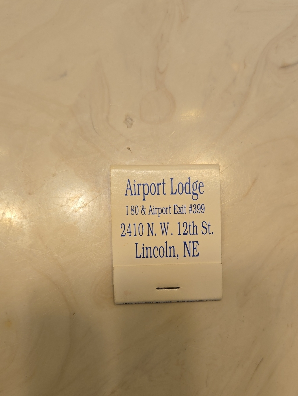 Airport Lodge Souvenir Card in White & Blue